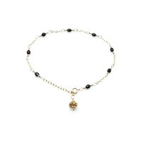 adjustable gold chain with Bali bead dangle