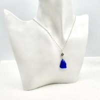 a pretty sterling silver curb chain with small sea glass pendant and tiny Bali bead accent