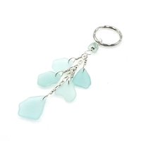 five light pastel aqua blue real sea glass charms dangle from sterling silver chain
