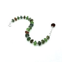 each sea glass piece is separated from the next with tiny silver accent beads