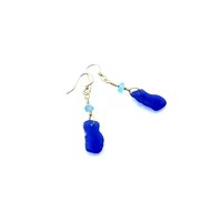the cobalt blue charms are from Puerto Rico and the tiny aqua pieces are from England