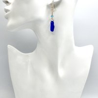 wire wrapped together by hand with 14K/20 gold filled wire and pierced fish hook style ear wires