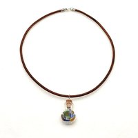hangs on an 18" brown leather cord