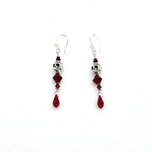 silver plated skull beads accented with deep red crystal bicone shaped beads and teardrop charms