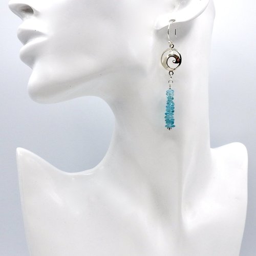 the aqua blue tiny beads dangle below in a long stacked design
