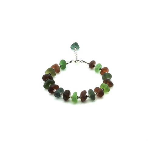 the real sea glass beads were drilled by me and strung together with tiny silver accent beads in between each piece
