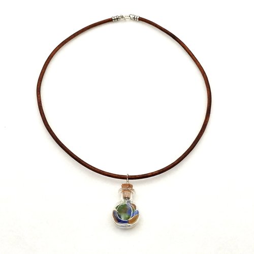 hangs on an 18" brown leather cord