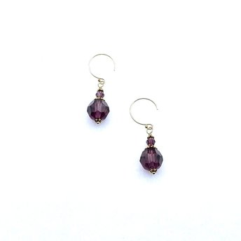  Dark purple short crystal earrings with tiny round beads above larger round beads. These drop earrings have tiny ornate gold plated beads and caps for accent. They have round 14K/20 gold filled pierced ear wires. 