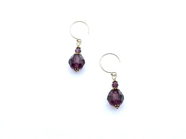  Dark purple short crystal earrings with tiny round beads above larger round beads. These drop earrings have tiny ornate gold plated beads and caps for accent. They have round 14K/20 gold filled pierced ear wires. 